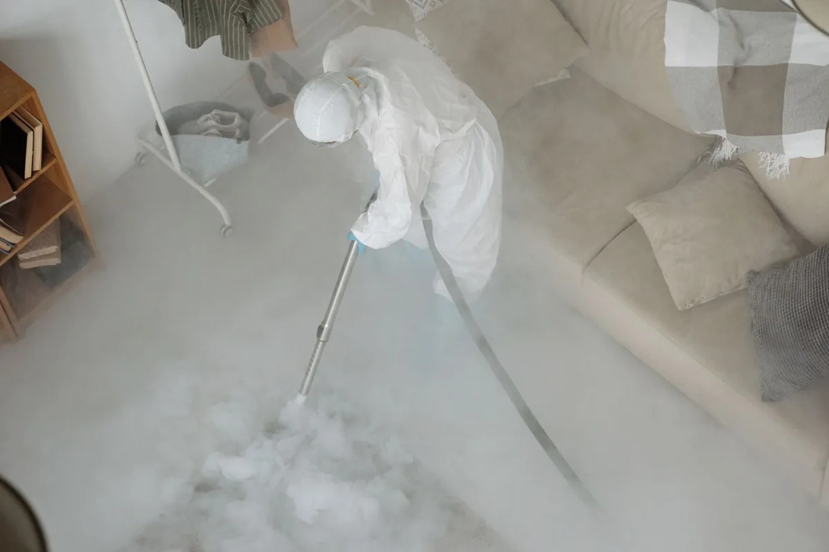Biohazard cleanup technician in protective equipment, Point Pleasant, NJ